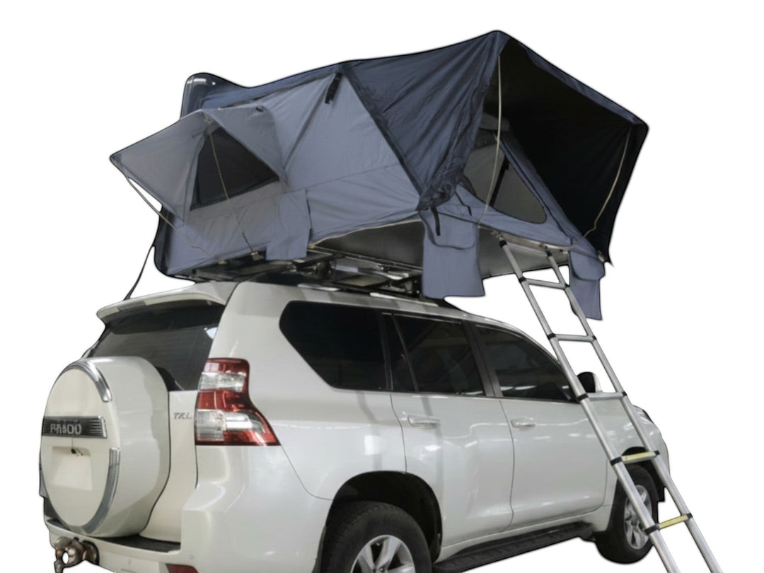 DesertX Basecamp hardshell rooftop tent in grey and black, mounted on a white SUV with a ladder.