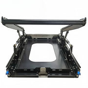 DesertX Drop Slider, a black galvanized steel vehicle fridge slider with hydraulic telescopic rod for easy access.