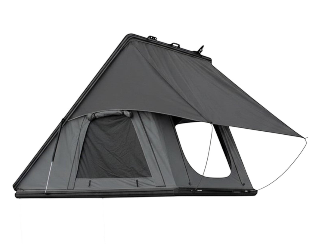 DesertX Trailblazer hard shell rooftop tent on a white SUV, grey fabric, with ladder attached.